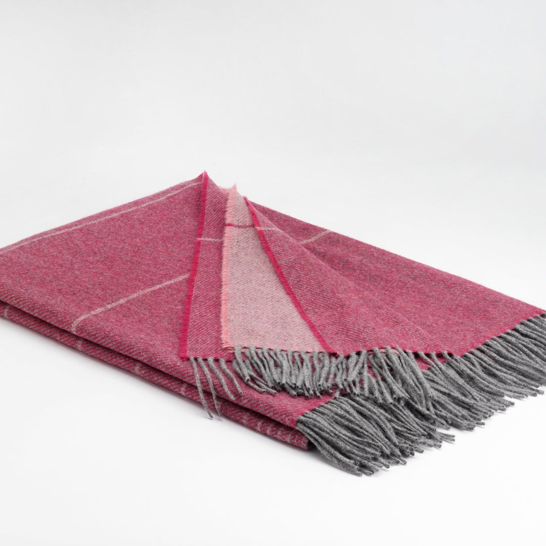 McNutt of Donegal | Cashmere Lambswool Throw Northern Lights Fuchsia by Weirs of Baggot Street